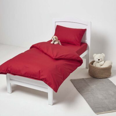 Dog toy on children's red cot duvet cover 